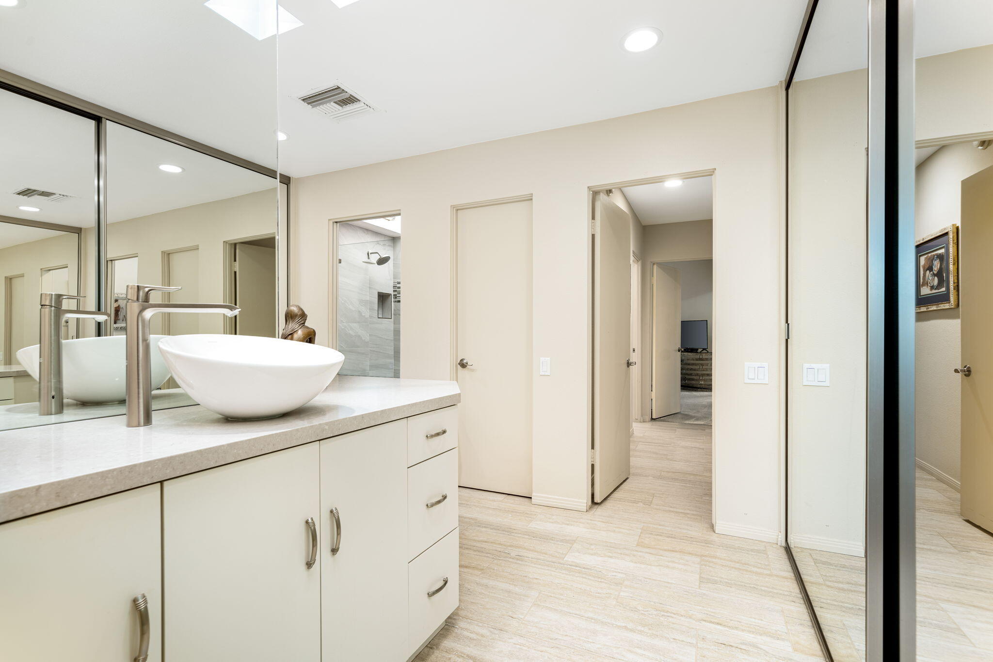 702 Inverness Drive Rancho Mirage, CA 92270 - Photo 33 of 49 a spacious bathroom with a granite countertop sink and a mirror