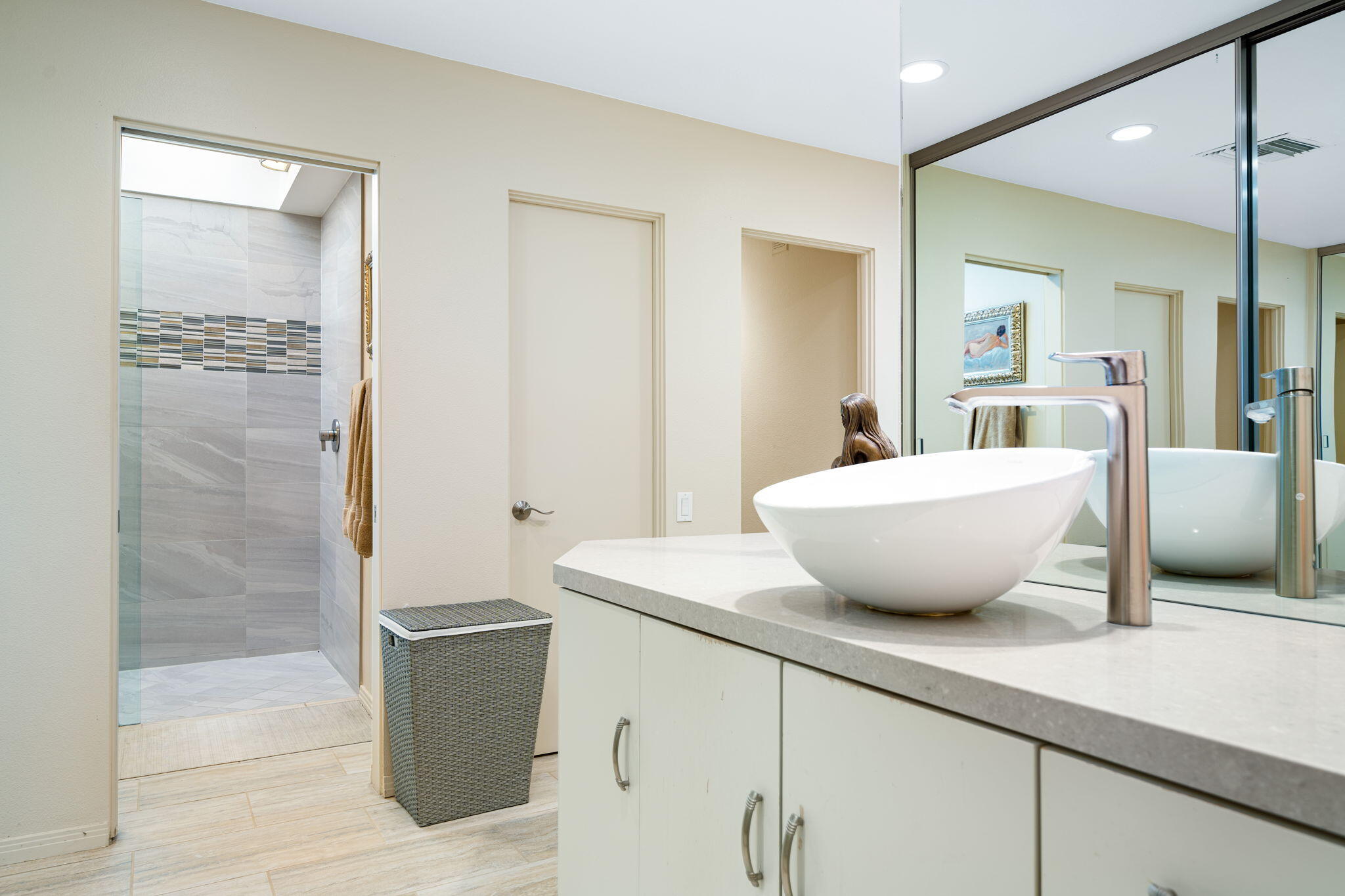 702 Inverness Drive Rancho Mirage, CA 92270 - Photo 34 of 49 a view of a bathroom with a granite countertop sink mirror and bathtub