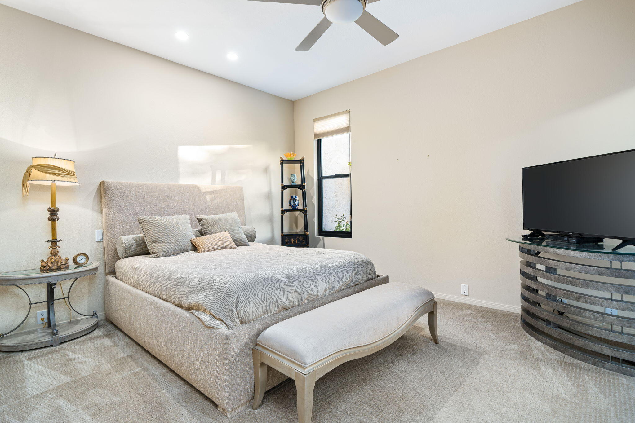702 Inverness Drive Rancho Mirage, CA 92270 - Photo 36 of 49 a bedroom with a bed and a flat screen tv