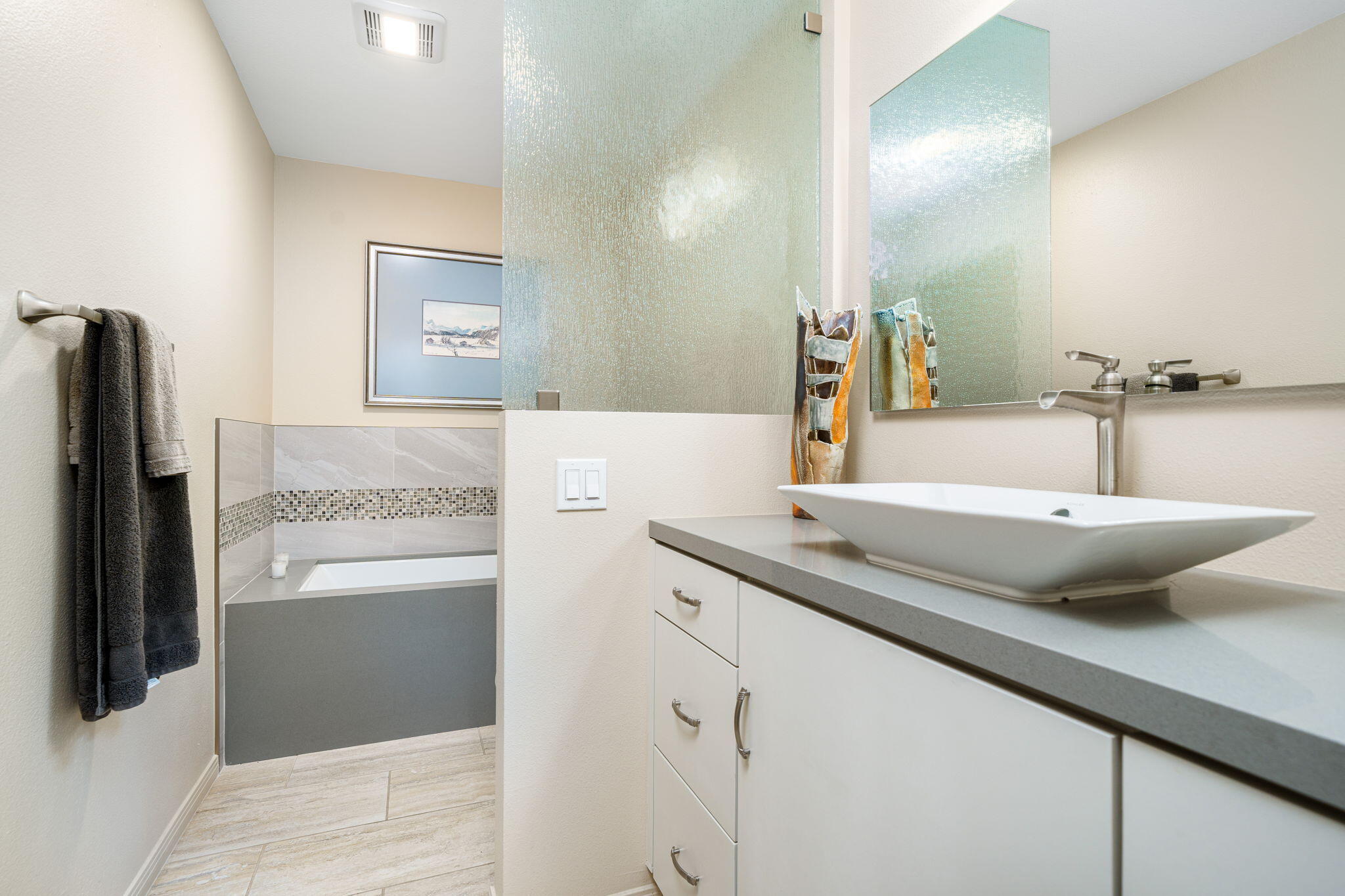 702 Inverness Drive Rancho Mirage, CA 92270 - Photo 38 of 49 a bathroom with a sink and a large mirror