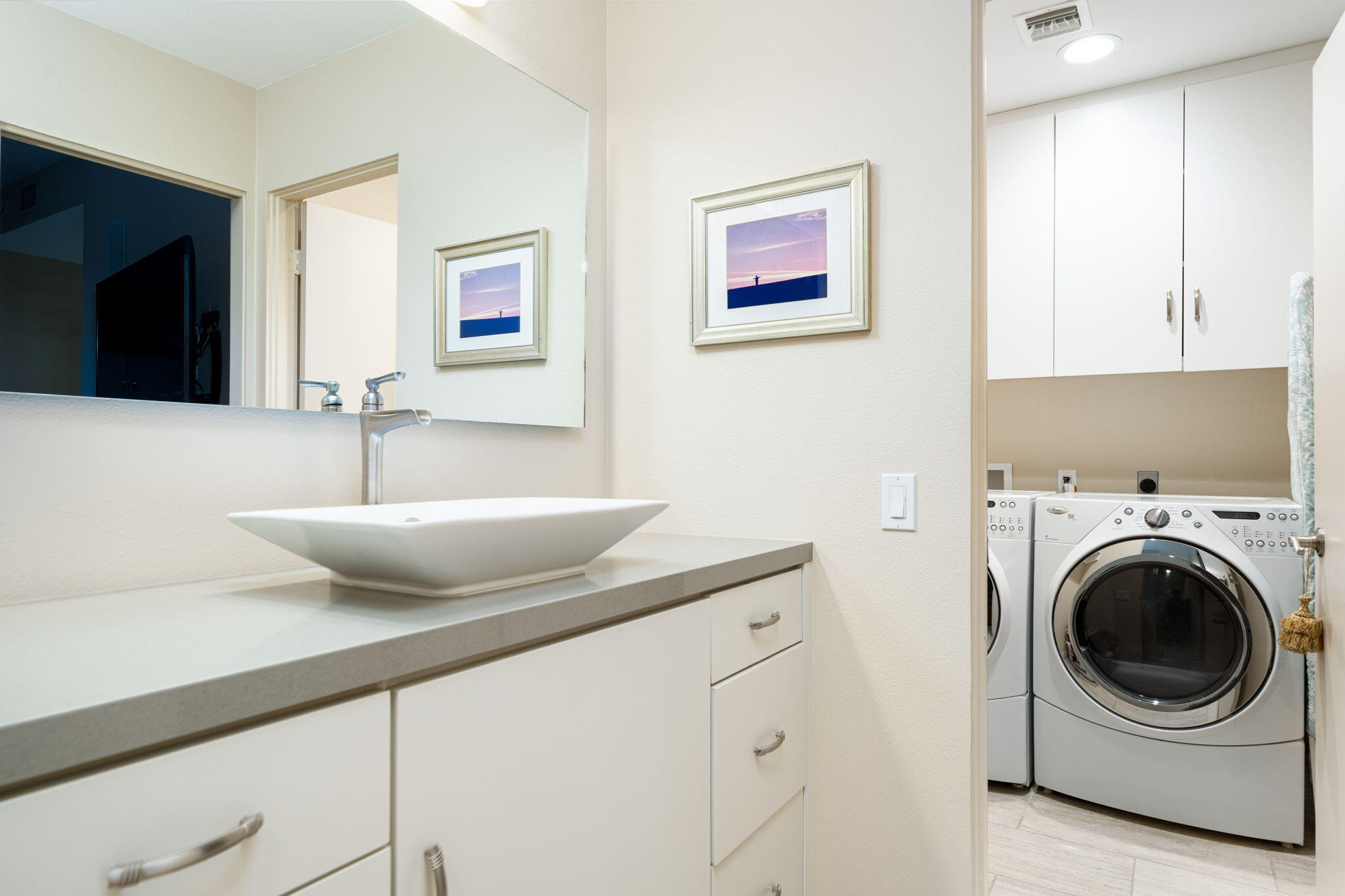 702 Inverness Drive Rancho Mirage, CA 92270 - Photo 40 of 49 a kitchen with a sink and a washer dryer
