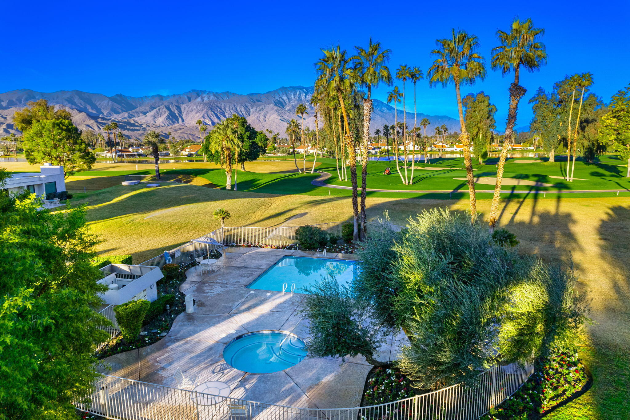 702 Inverness Drive Rancho Mirage, CA 92270 - Photo 4 of 49 a view of a lake with houses in the back
