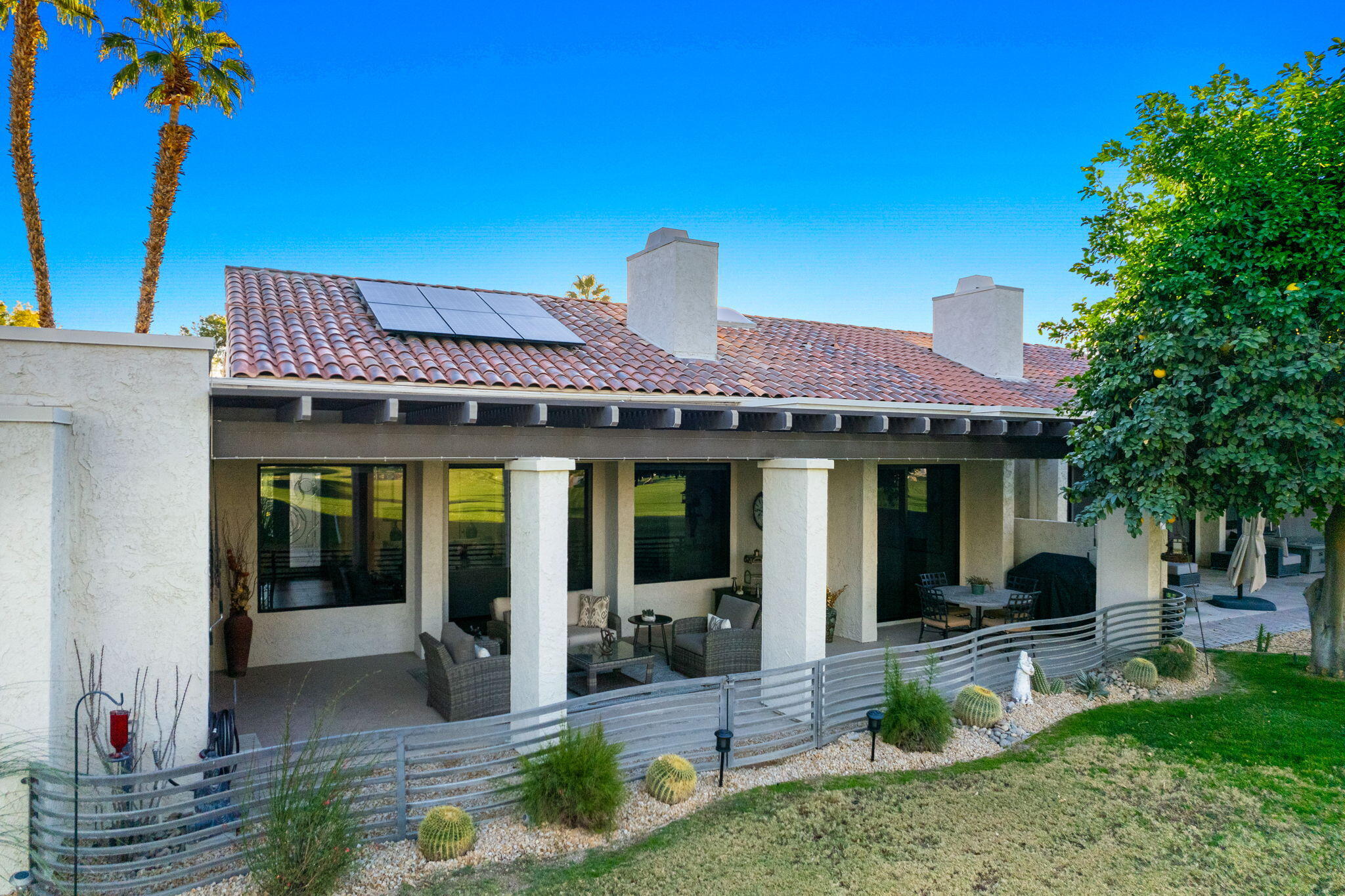 702 Inverness Drive Rancho Mirage, CA 92270 - Photo 45 of 49 a front view of a house with garden