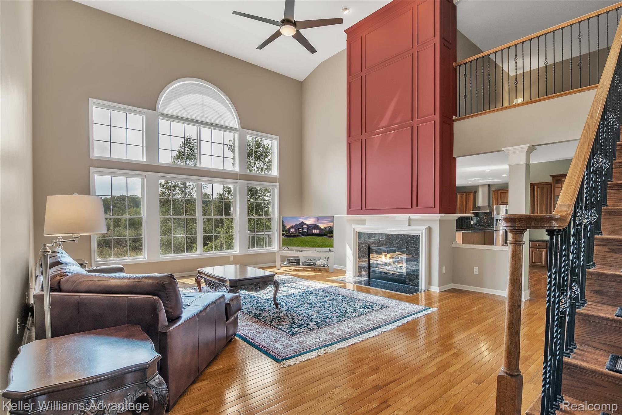 9042 Ridgefield Drive Brighton, MI 48114 - Photo 11 of 61 The great room with Hardwood throughout and beaming natural light