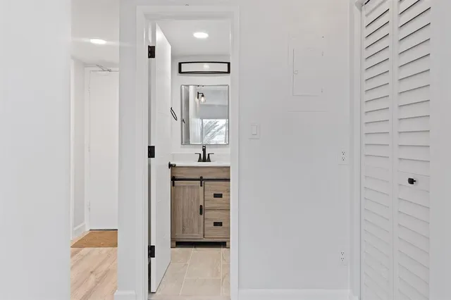 a bathroom with a sink and a mirror