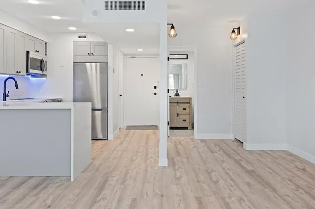 a view of kitchen with wooden floor