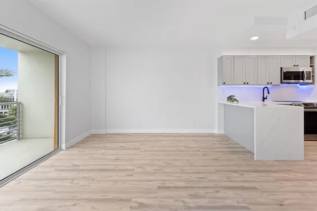 a view of kitchen with wooden floor