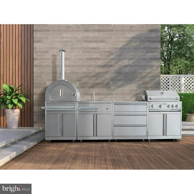 Any Fairfax, VA 22030 - Photo 19 of 19 a kitchen with a sink and a stove