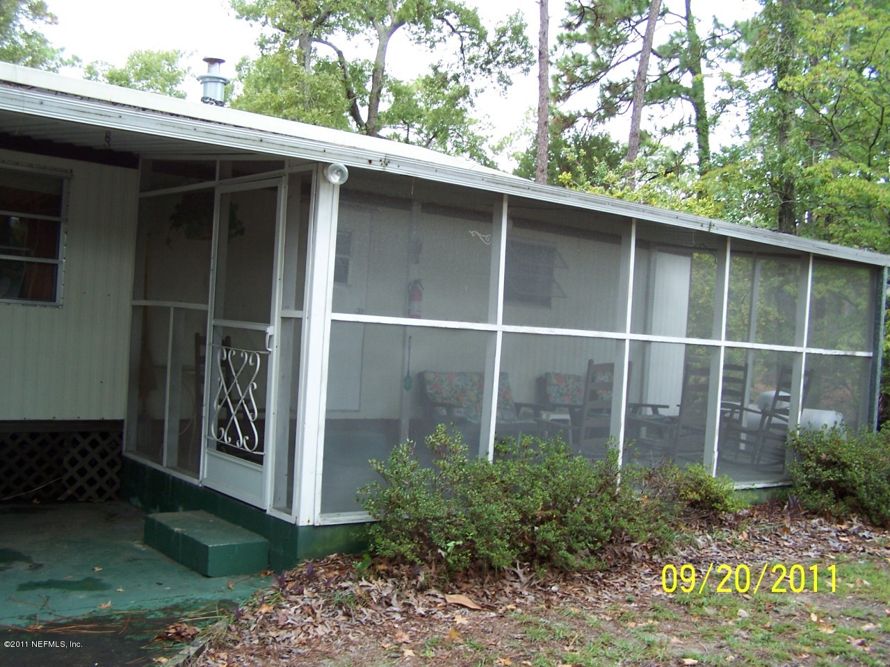 56027 Yulee Hills Road East Yulee, FL 32097 - Photo 8 of 11 SCREENED PORCH OUTSIDE VIEW
