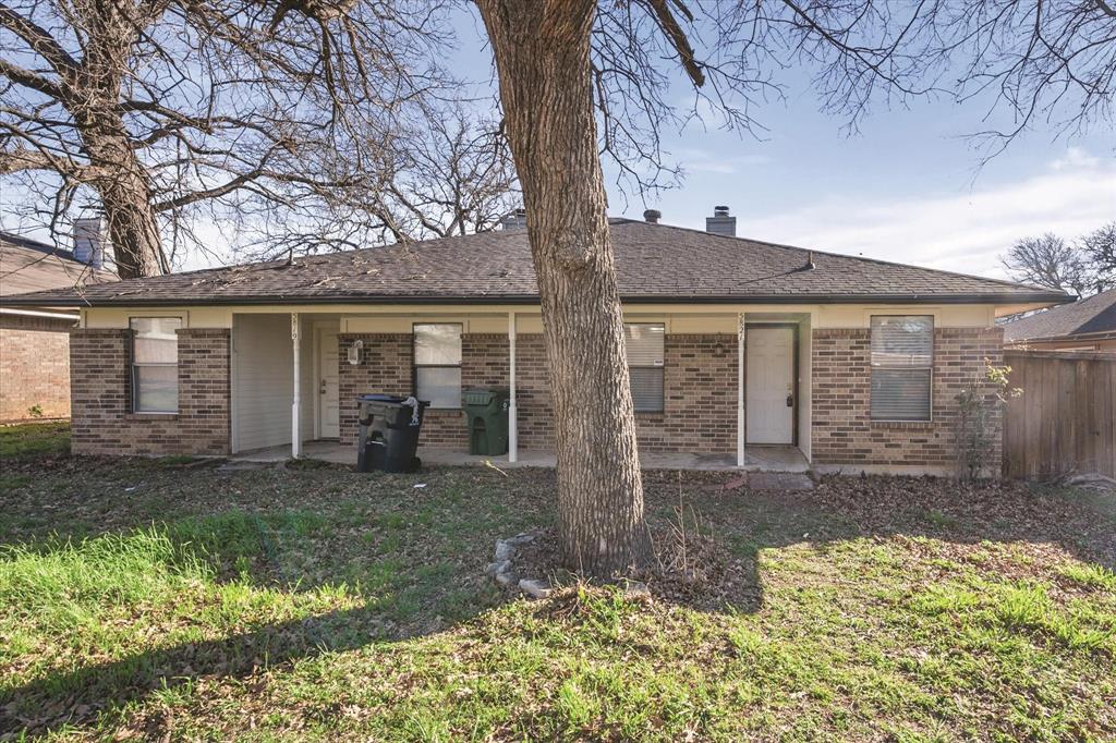 5821 Mansfield Road Arlington, TX 76017 - Photo 4 of 24 front view of a house with a yard
