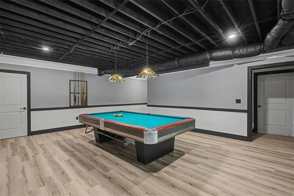 1136 Cole Lake Road Dallas, GA 30157 - Photo 51 of 72 a room with wooden floor pool table and windows