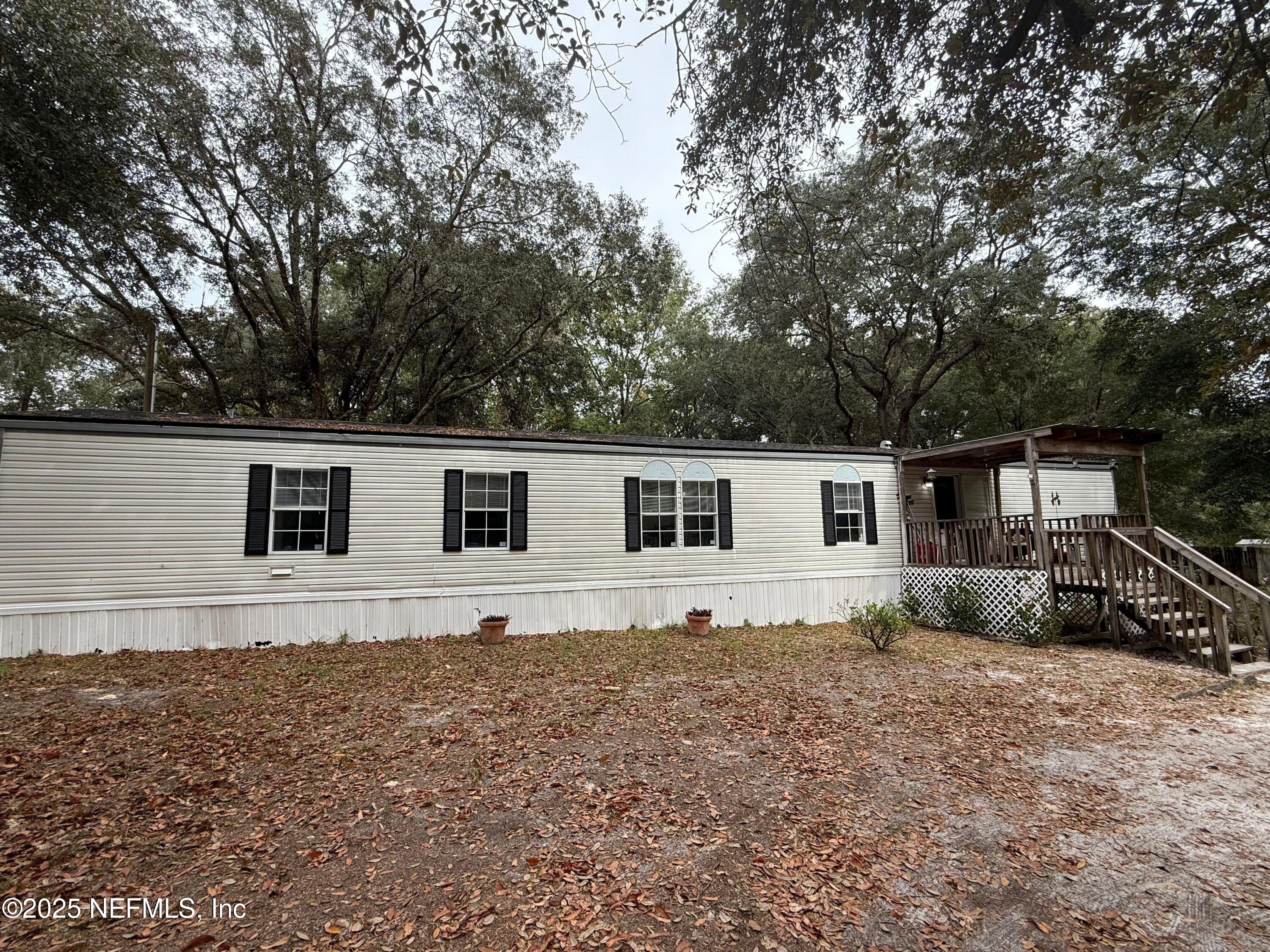 209 Dolphin Circle Middleburg, FL 32068 - Photo 3 of 20 a house view with a outdoor space