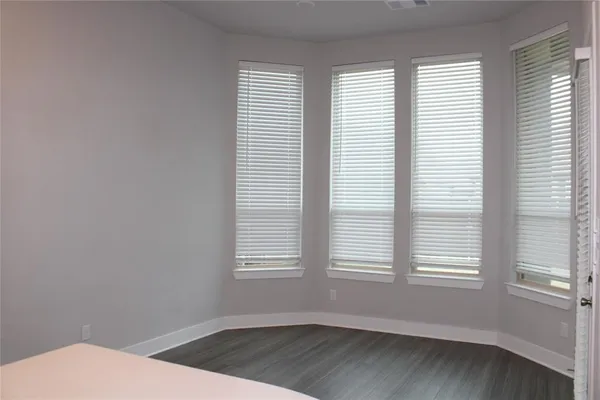a view of a room that has a window in it