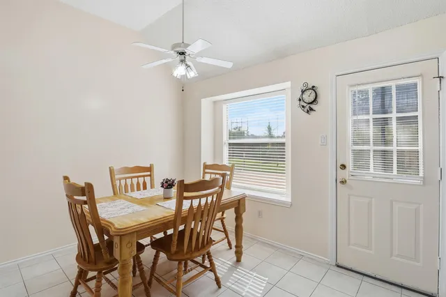 a bedroom with a bed and a flat tv screen on dresser
