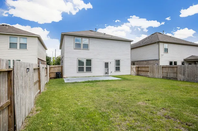 a view of a backyard with a garden and plants