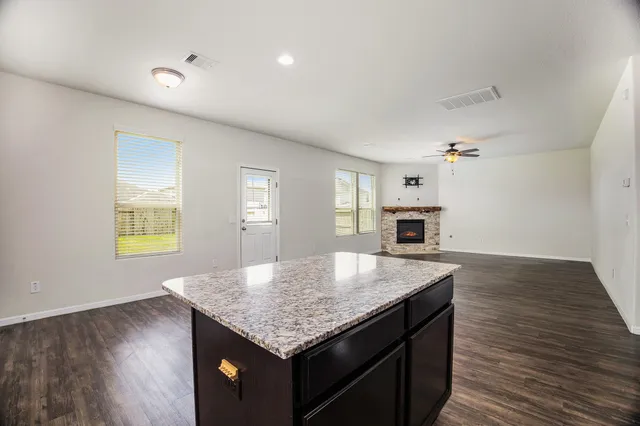 a kitchen with a table and chairs in it