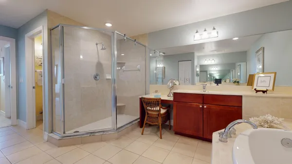 a bedroom with bed and a large window