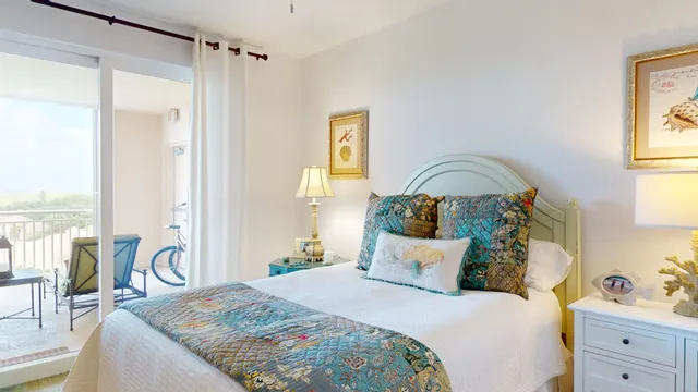 a view of a dining room with furniture and a window