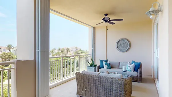 a view of a balcony with hardwood