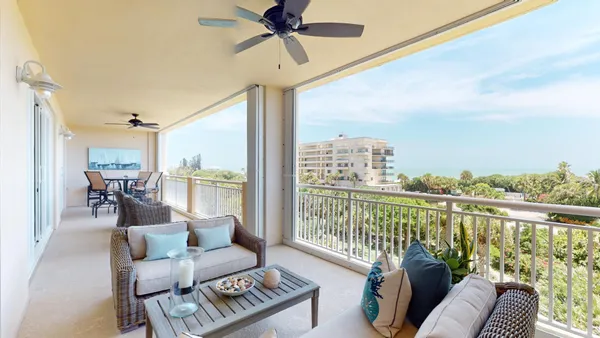 a view of swimming pool with seating area