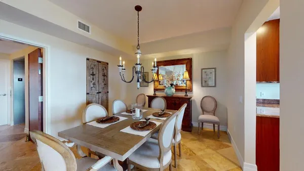 a kitchen with stainless steel appliances granite countertop wooden cabinets a stove and a sink