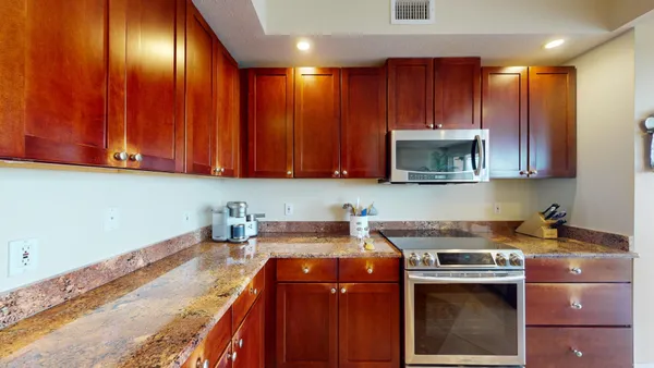 a view of a dining room with furniture and front door