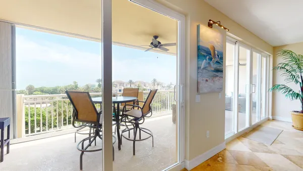 a view of living room with furniture and flat screen tv