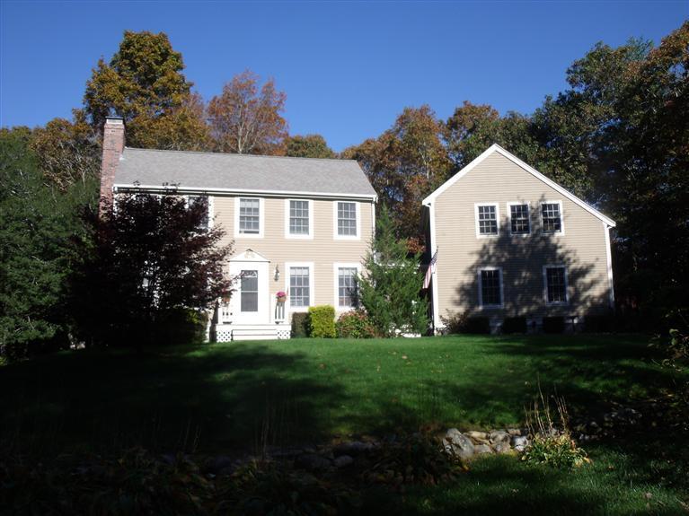 14 Woodside Road West Barnstable, MA 02668 - Photo 1 of 29 a front view of a house with a garden