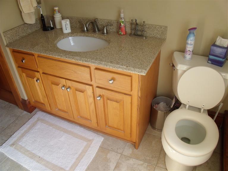 14 Woodside Road West Barnstable, MA 02668 - Photo 11 of 29 a bathroom with a granite countertop toilet sink and mirror
