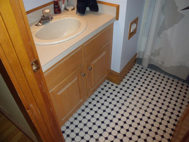 14 Woodside Road West Barnstable, MA 02668 - Photo 13 of 29 a bathroom with a sink and a mirror