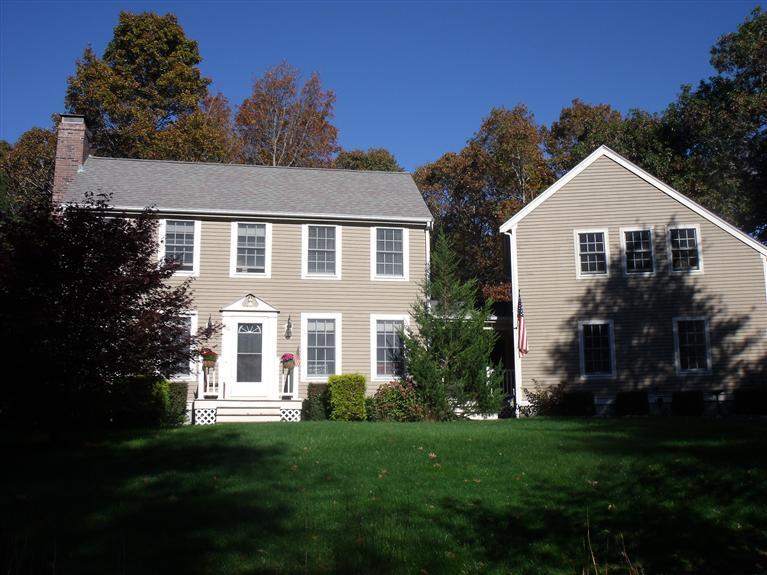 14 Woodside Road West Barnstable, MA 02668 - Photo 23 of 29 a front view of a house with a garden