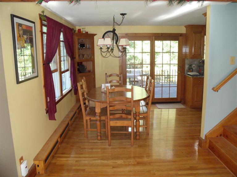 14 Woodside Road West Barnstable, MA 02668 - Photo 4 of 29 a dining room with furniture a chandelier and wooden floor