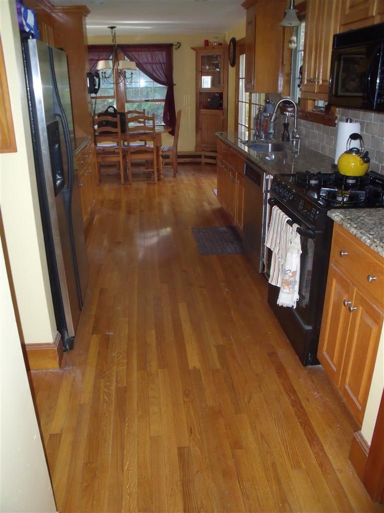 14 Woodside Road West Barnstable, MA 02668 - Photo 6 of 29 a kitchen with granite countertop a stove a sink a refrigerator and wooden floor