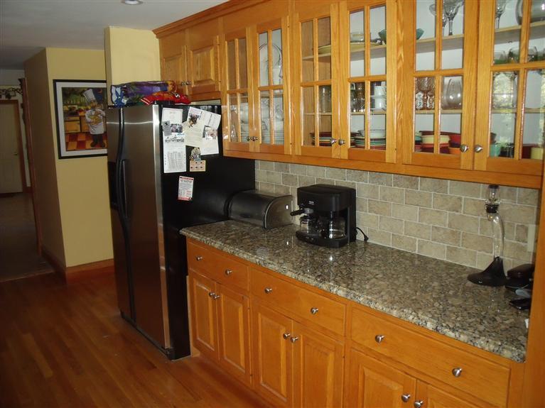 14 Woodside Road West Barnstable, MA 02668 - Photo 7 of 29 a kitchen with stainless steel appliances granite countertop a refrigerator and a sink