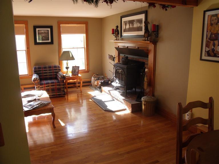 14 Woodside Road West Barnstable, MA 02668 - Photo 8 of 29 a living room with furniture and a fireplace