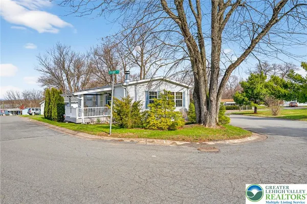 a house with trees in front of it