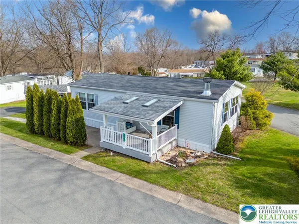 a aerial view of a house with a yard