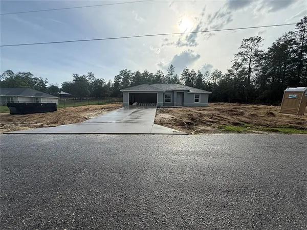 a view of a house with a street