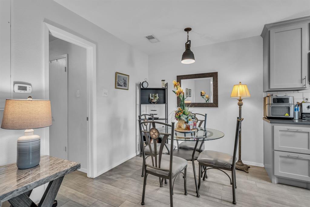 5981 Arapaho Road, Unit 1307 Dallas, TX 75248 - Photo 11 of 31 a dining room with furniture and window