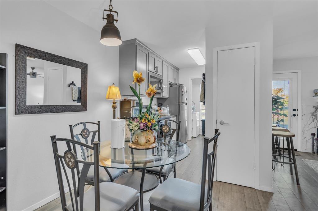 5981 Arapaho Road, Unit 1307 Dallas, TX 75248 - Photo 12 of 31 a view of a dining room with furniture and wooden floor
