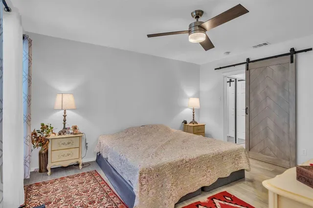 a bed room with a bed and a dresser