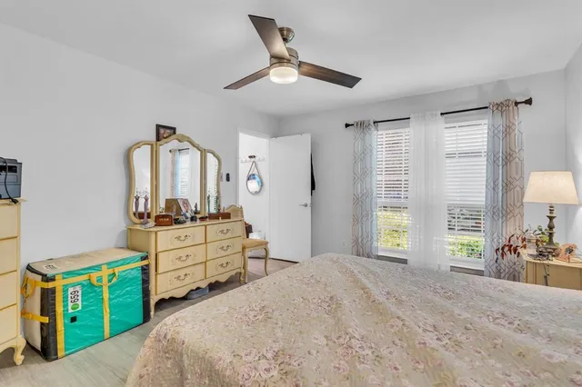 a white toilet sitting next to a shower
