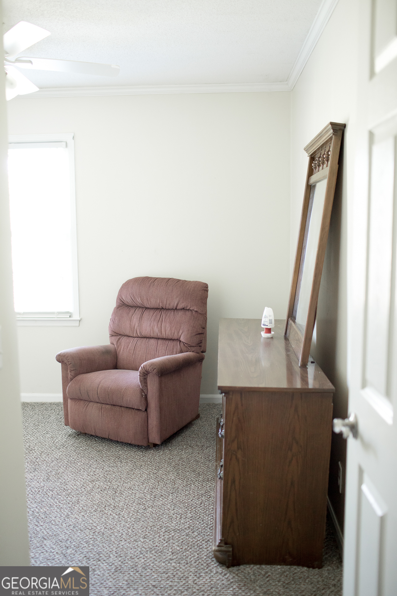 2110 Ware Street Blackshear, GA 31516 - Photo 36 of 57 a living room with furniture and a window