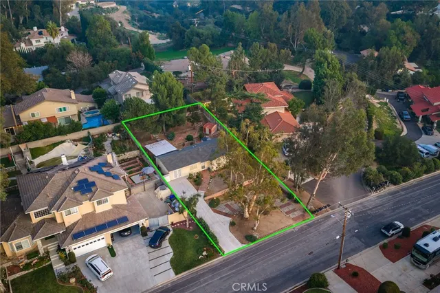 an aerial view of house with yard swimming pool and outdoor seating