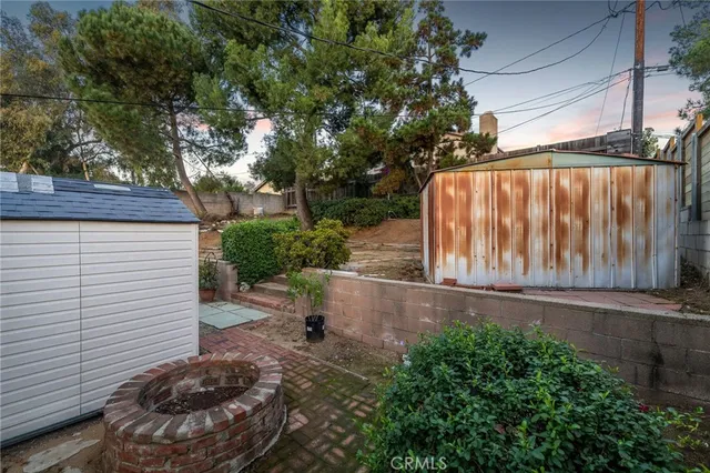 a view of backyard with cabin
