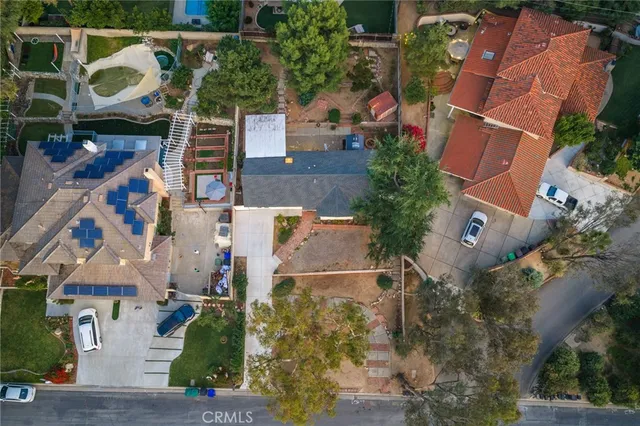 an aerial view of houses with outdoor space