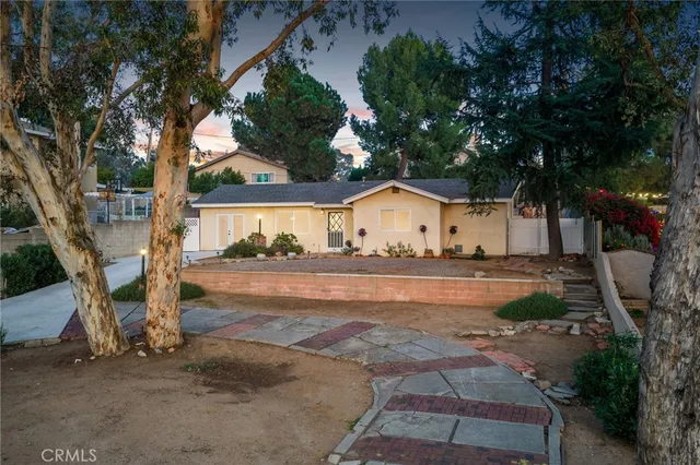 a view of house with outdoor space