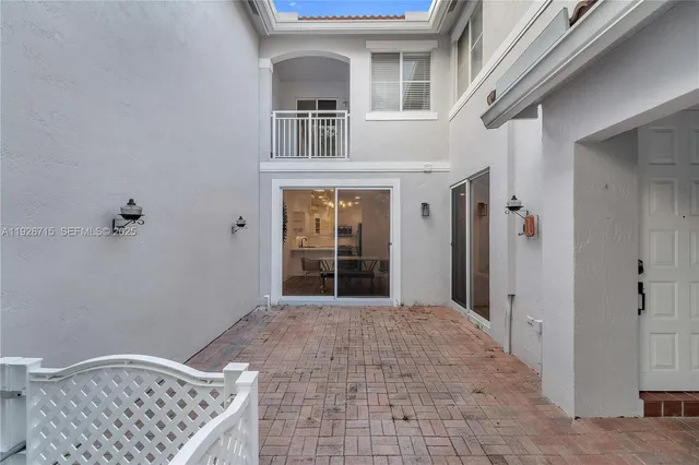 a view of a swimming pool with outdoor seating