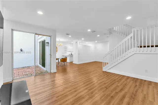 a kitchen with stainless steel appliances a refrigerator stove microwave and sink