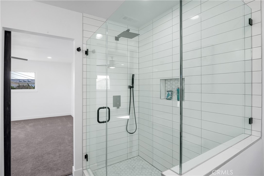 4312 Myra Avenue Cypress, CA 90630 - Photo 22 of 38 a bathroom with a shower